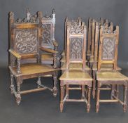 A set of ten 19th Century French Gothic style oak dining chairs, the eight standard chairs with four