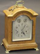 An early 20th Century oak cased mantel clock,