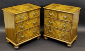 A pair of 18th Century style walnut chests with two short over two long drawers on squat bun feet,