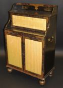 An early 19th Century black lacquered and chinoiserie decorated portable chiffonier the three
