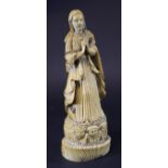 A 19th Century or earlier carved Goanese figure of the Madonna her hands clasped in prayer before