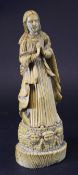 A 19th Century or earlier carved Goanese figure of the Madonna her hands clasped in prayer before