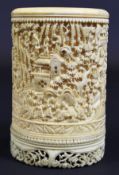 A 19th Century Chinese carved ivory tusk brush pot or vase ornately decorated with figures amongst