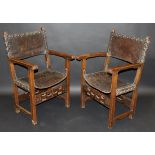 A pair of 17th Century walnut framed Spanish hall chairs with tooled brown leather backs and seat