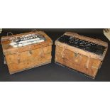 Two heavy brass bound leather "Yakdan" military style trunks with heavy leather carrying handles,