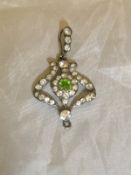 An Art Nouveau style white stone and green stone set pendant