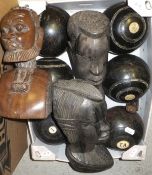 A box containing a collection of vintage lawn bowls,