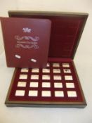 A collection of silver ingots in presentation case inscribed "Elizabeth Our Queen,