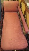 A mahogany framed chaise longue in dark pink ground fleur de lys patterned upholstery