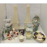 A collection of decorative china wares to include a pair of large cream pottery obelisks raised on