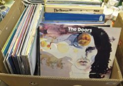 A box of LP records including The doors "Weird scenes inside the Gold Mine",