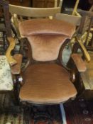 A walnut framed salon chair with peach ground upholstered seat,