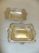 A pair of rectangular bonbon dishes with pierced scrolling decoration (by William Comyns & Son,