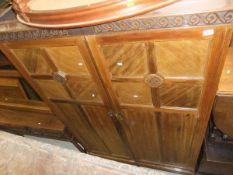 A mahogany two door wardrobe