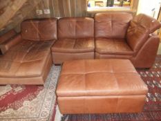 A modern leather upholstered corner sofa comprising, lounger chair, single chair, corner chair and