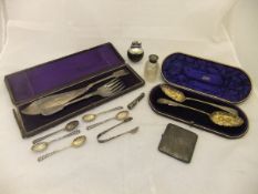 A box containing a cased set of two Victorian silver berry spoons (Birmingham 1898),