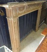 A pine fire surround with applied decoration in the Adams manner CONDITION REPORTS 135cm high, 161cm