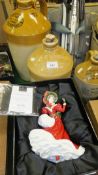 A Royal Doulton figurine "Christmas Day 2005" (boxed), together with three stoneware flagons,