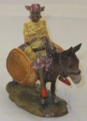 A Beswick pottery "Susie Jamaica" figurine depicting a girl riding a donkey, model No.