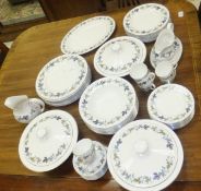 A collection of Royal Doulton "Burgundy" pattern dinner wares to include lidded tureens,