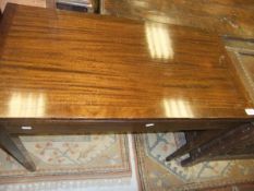 An early to mid 20th Century mahogany fold over card table on square tapered legs