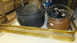 A collection of metal and treen wares to include a copper cauldron, a large cast iron pot with lid,