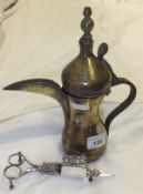 A brass Turkish/Iznik coffee pot with stamped Tughra together with a pair of 19th Century steel