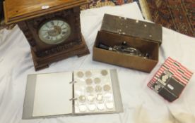 A box containing a collection of British coins, a collection of plated cutlery, binoculars,