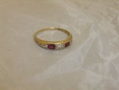 A ruby and diamond set 18 carat gold dress ring CONDITION REPORTS Approx. 2.8 gms including