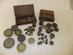 A collection of apothecary and other weights (boxed),