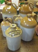 A collection of six stoneware flagons / jars to include examples inscribed "Hector & Co.,