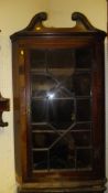 A 19th Century mahogany wall hanging corner cabinet with astragal glazed door and swan neck