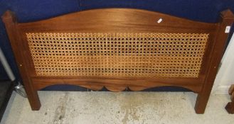 A mahogany framed and caned double bed frame with drawer beneath