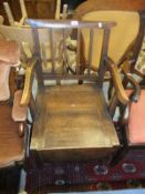 A mahogany box seat commode arm chair
