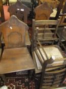 Three mahogany framed Gothic style hall chairs, three woolwork covered cushions,