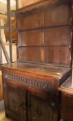 An Old Charm style oak dresser, the plate rack over a single drawer,