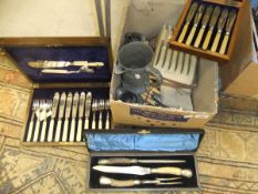 A box of assorted cutlery to include a cased three piece carving set, together with a pewter jug,