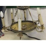 An Edwardian brassed six branch electrolier of circular form with acanthus decorated brass candle