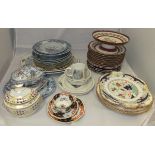 A late 19th / early 20th Century part dessert service decorated in burgundy and gilt and with