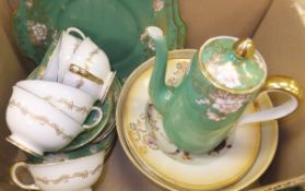 A box containing a small collection of china wares to include a Crown Staffordshire part tea