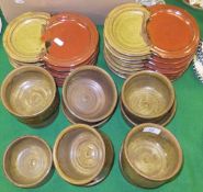 A collection of studio pottery plates and bowls