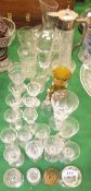 A cut glass claret jug with plated mounts, glass wine ewer and various drinking glasses,