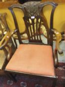 A 19th Century mahogany elbow chair with drop-in seat