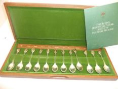 A cased set of 12 silver spoons with gold plated finials for the Royal Horticultural Society,