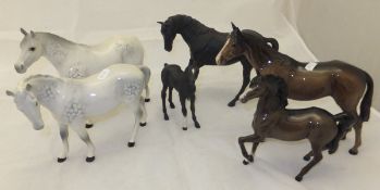 A collection of five Beswick horses and a Beswick foal to include black horse,