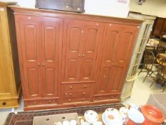 A modern painted pine wardrobe compactum in the 19th Century manner,