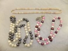 Three pearl necklaces