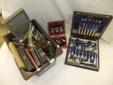 A box of assorted plated wares to include a pair of plated pheasants, various corkscrews,