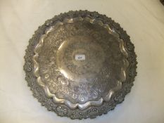 A late Victorian plated circular tray with oak leaf and acorn central medallion decoration,