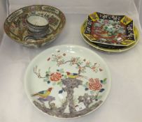 A 19th Century Chinese polychrome decorated charger, the centre field decorated with two birds